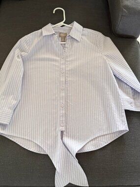 Blue and white vertical-striped button-down shirt is from Chico's.